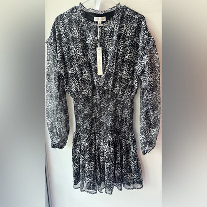 824. SHE AND SKY DRESS. Black with white florals. Size large.