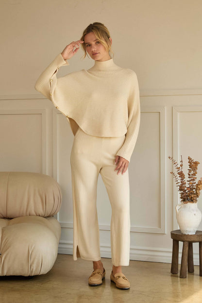 ASYMMETRICAL BUTTON-SLEEVE RIBBED MOCK NECK SWEATER TOP