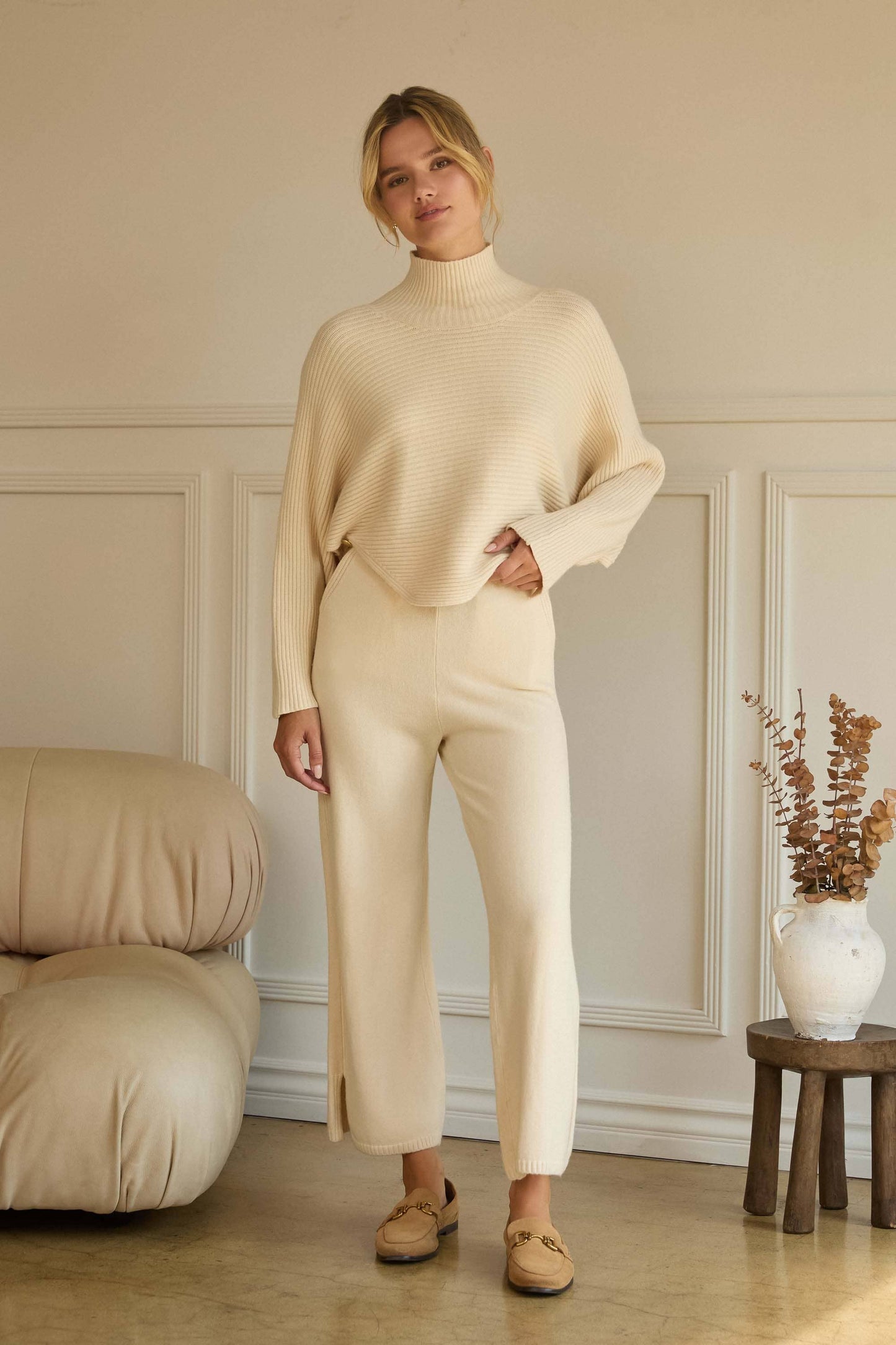 ASYMMETRICAL BUTTON-SLEEVE RIBBED MOCK NECK SWEATER TOP