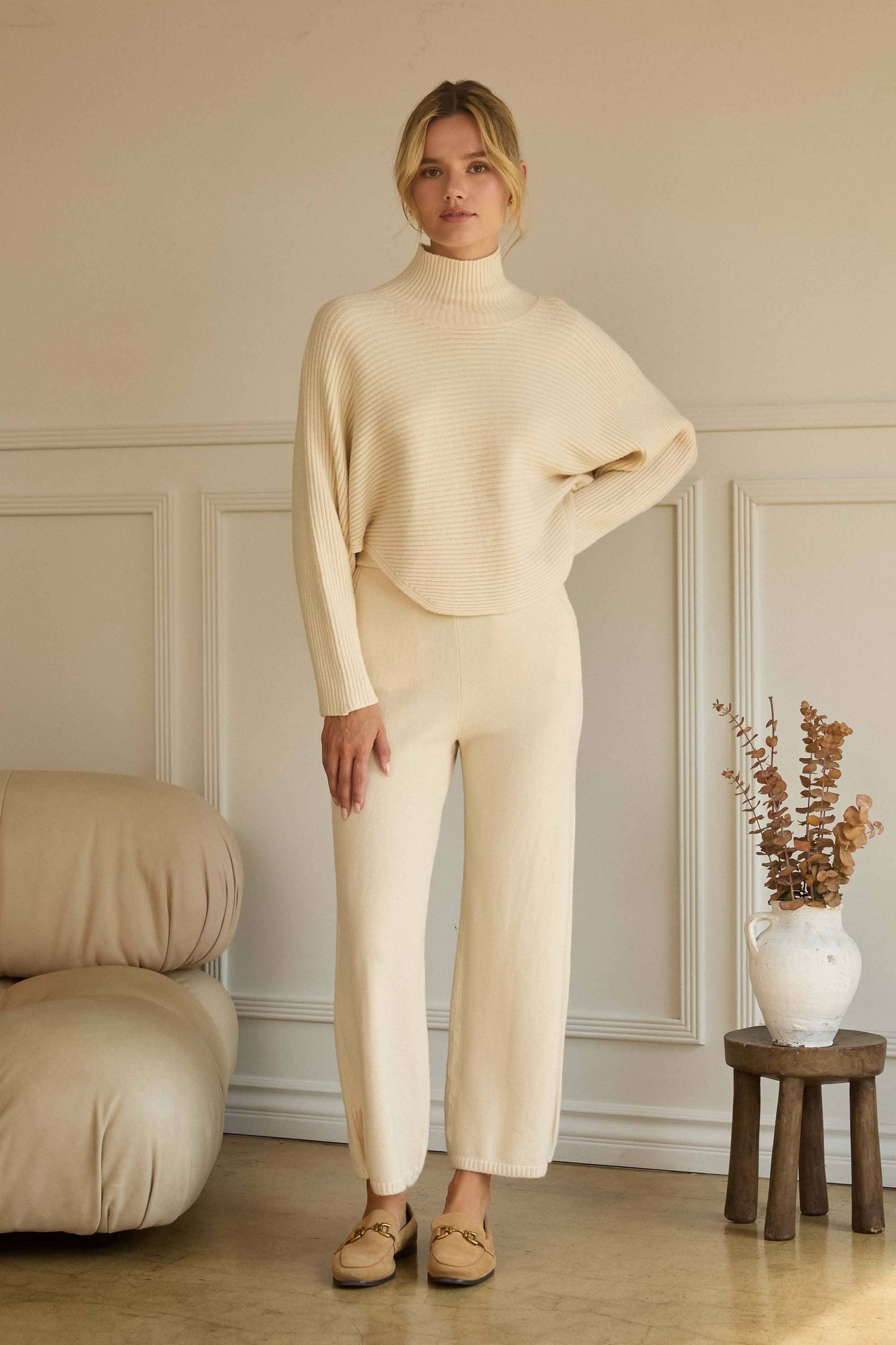 ASYMMETRICAL BUTTON-SLEEVE RIBBED MOCK NECK SWEATER TOP