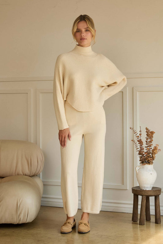 ASYMMETRICAL BUTTON-SLEEVE RIBBED MOCK NECK SWEATER TOP