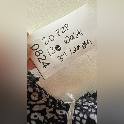 824. SHE AND SKY DRESS. Black with white florals. Size large.